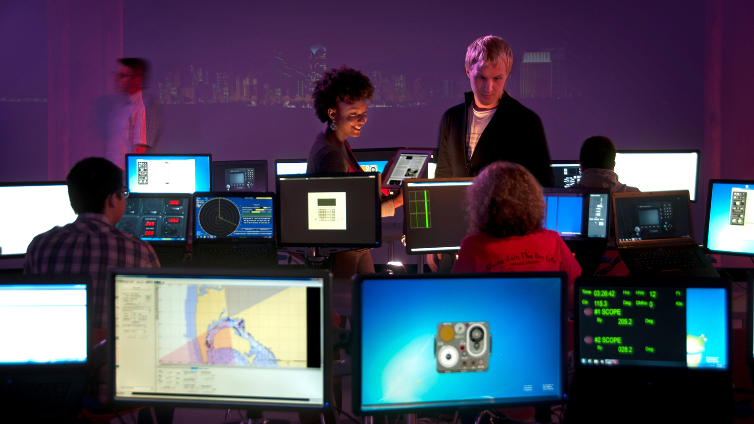 Students work on a project in the Hunt Library immersion studio.