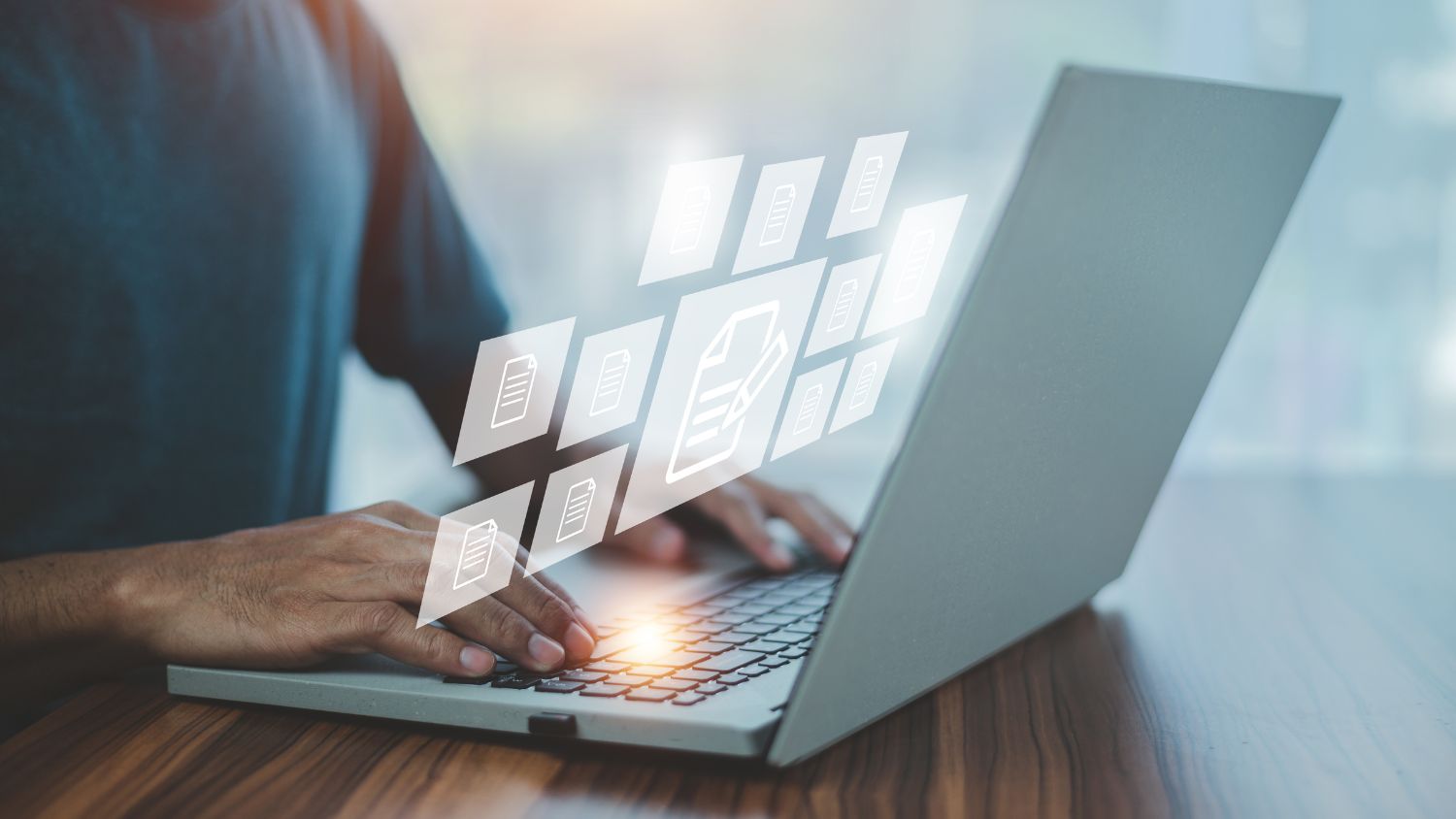 person on laptop with digital icons
