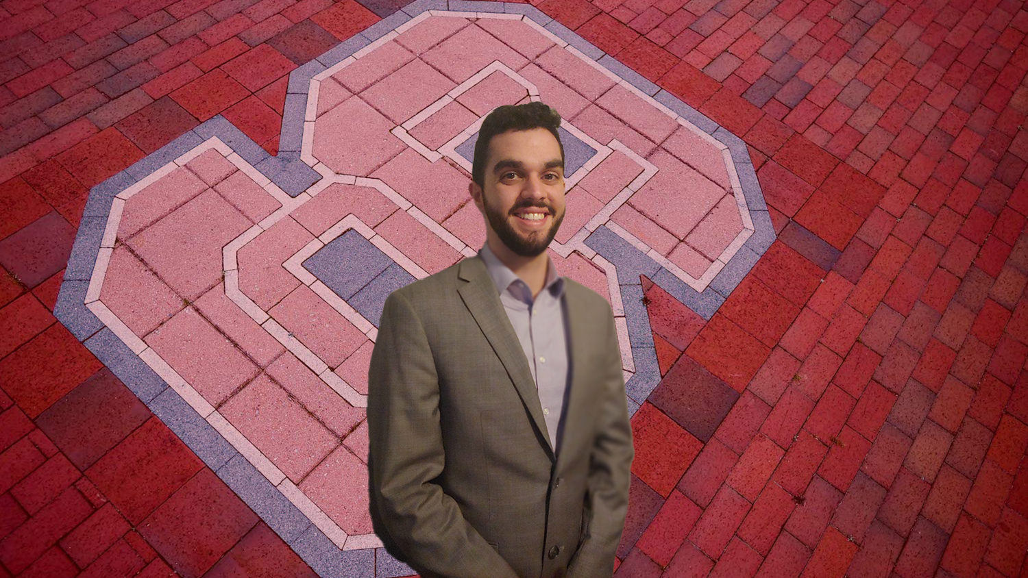 Header for news post - MMB Student Dilan Rivera in front of The NC State block "S" logo in brick off Varsity Drive.