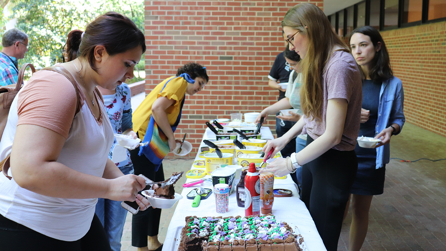 Header for news post - PMB students making ice cream Sundays at the ice cream social